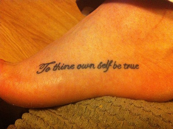 Dreams do come true lettering tattoo on the hip